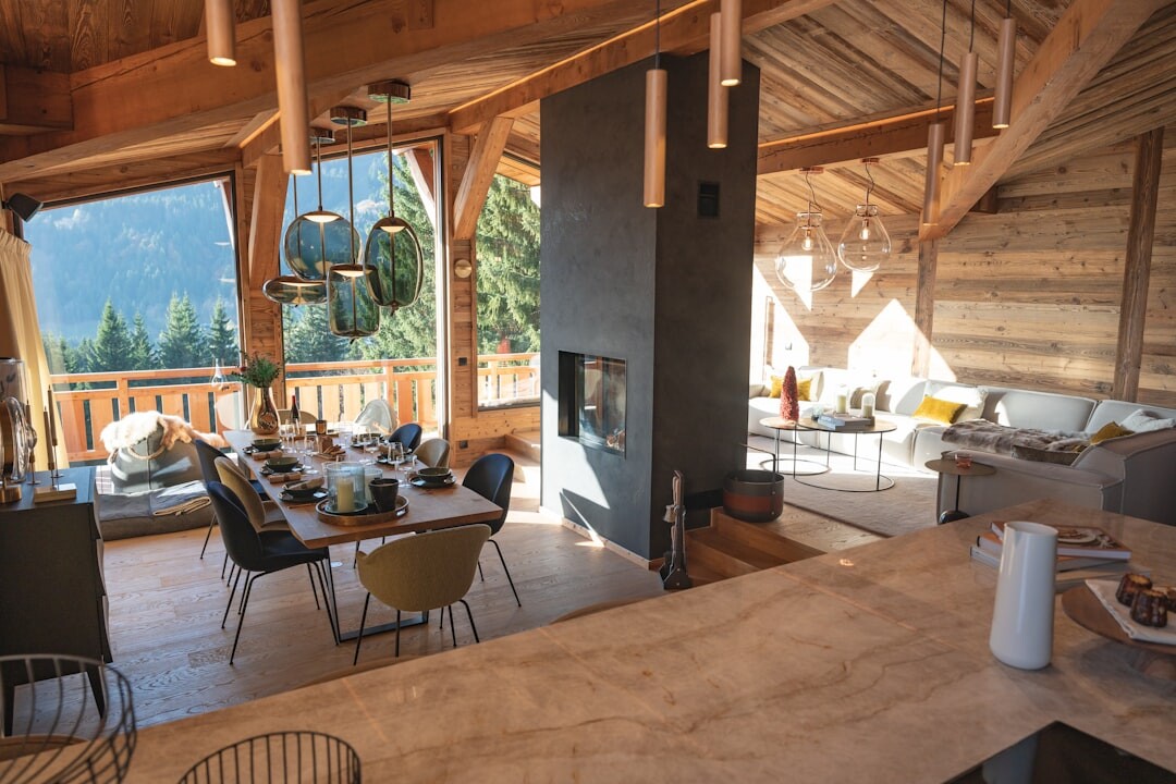 Cozy chalet lounge with stone fireplace and wooden beams